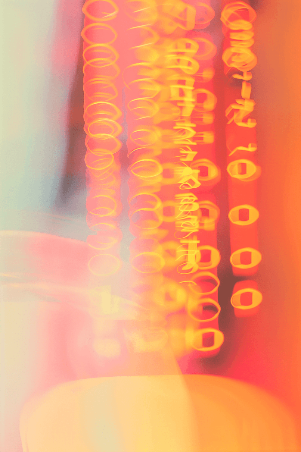 Abstract streaks of orange and yellow light forming soft glowing loops